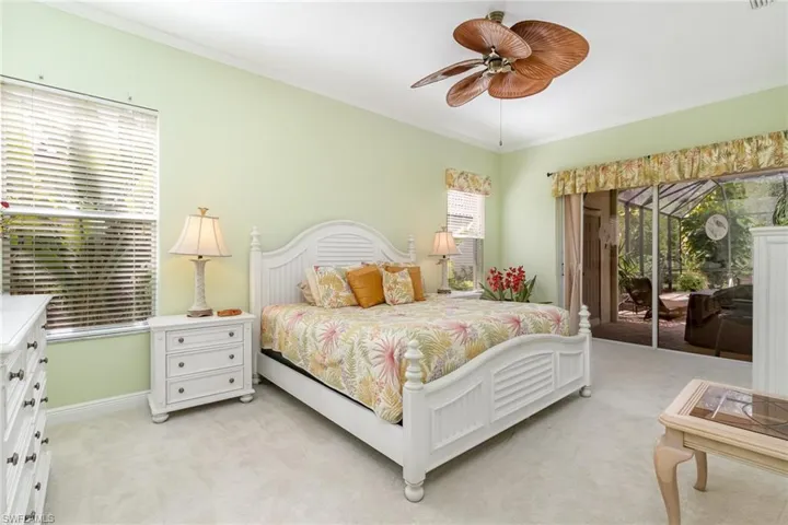 Master Bedroom with a slider to the pool area.