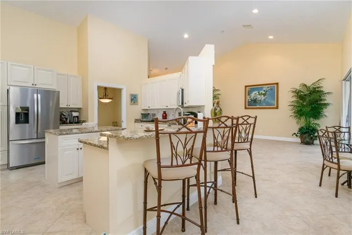 Kitchen with stainless steel appliances and granite countertops.