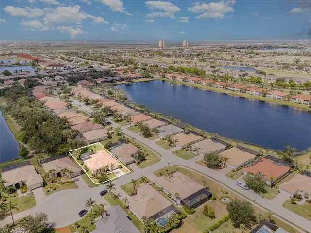 Aerial perspective of suburban area with a large body of water