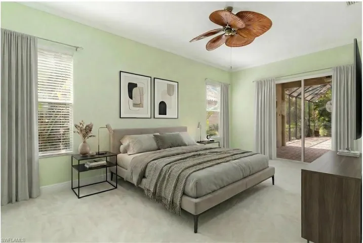 Virtually Edited. Master Bedroom featuring access to outside, light colored carpet, a ceiling fan, and crown molding