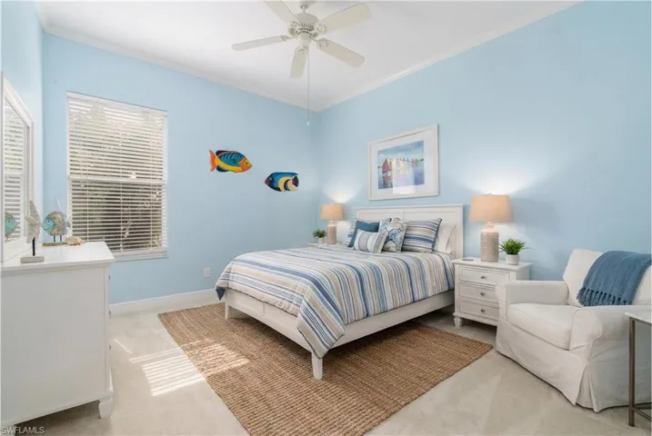 Virtually Edited. Bedroom 3 featuring crown molding, light carpet, and a ceiling fan