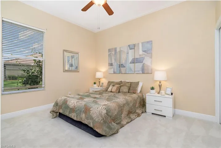 Virtually Edited. Bedroom 2 featuring crown molding, carpet, and a ceiling fan
