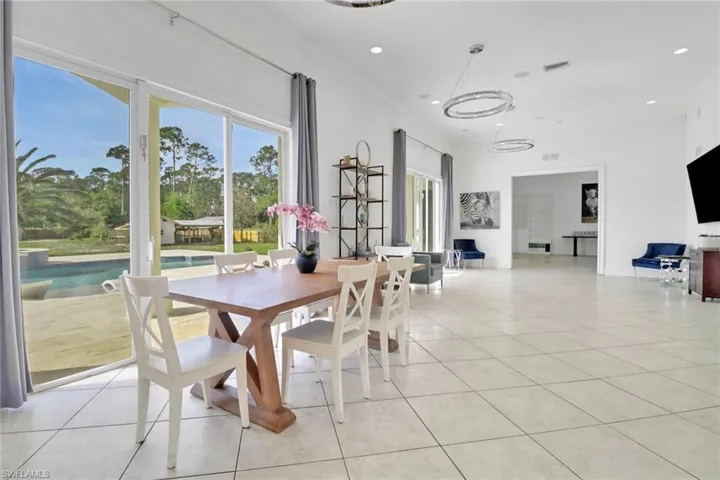 Dining room with recessed lighting, visible vents, and light tile patterned flooring
