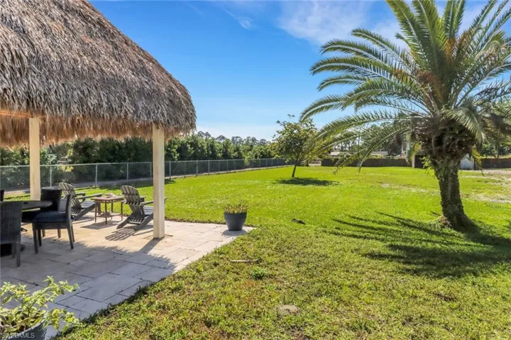 View of yard featuring a patio area and fence