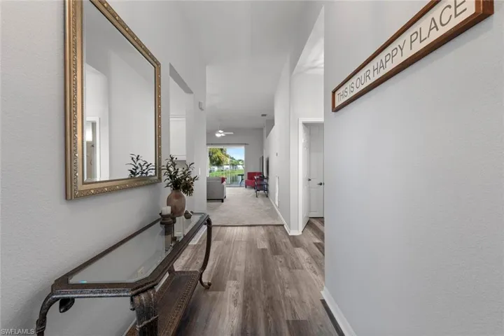 Corridor featuring hardwood / wood-style flooring
