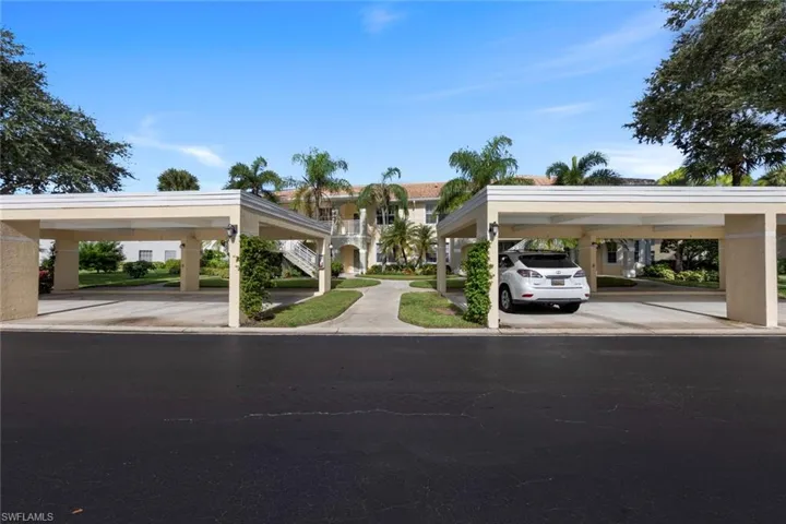 View of front of house with a carport