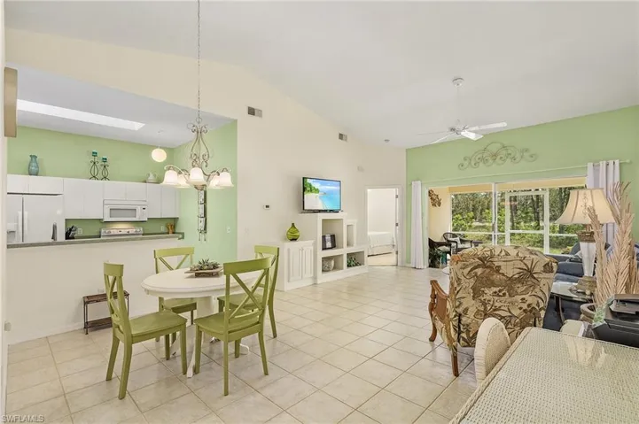 OPEN Split floor plan make the Villa feel much larger than 1,042 sq ft with vaulted ceiling, view of Lake, screened patio with southern rear exposure.