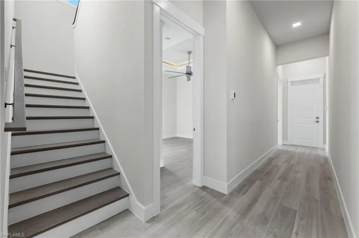 Stairway to 2nd tory bonus room and additional guest room and bathroom