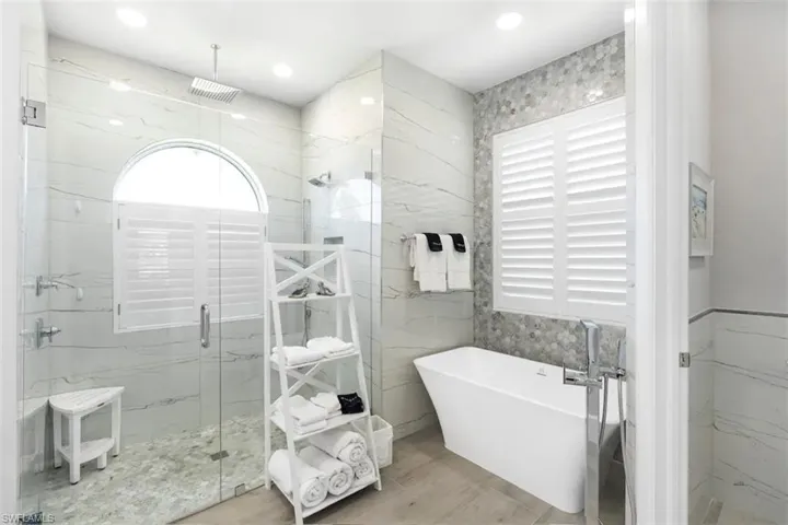 Bathroom featuring separate shower and tub