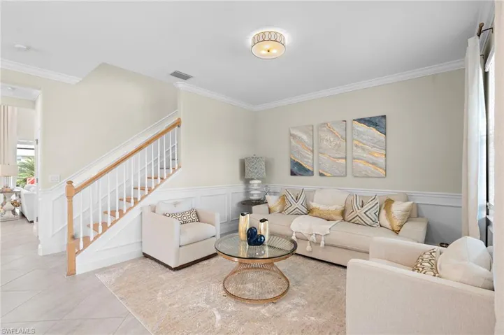 Tiled living room with crown molding