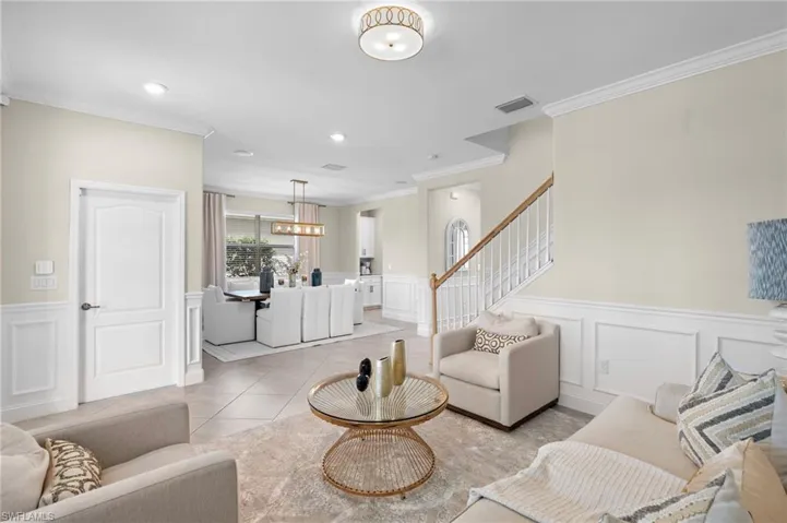 Tiled living room with ornamental molding