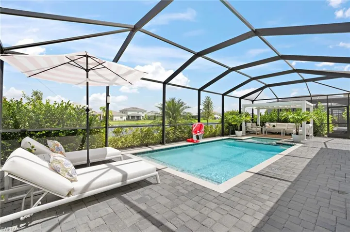 View of pool featuring a lanai and a patio area