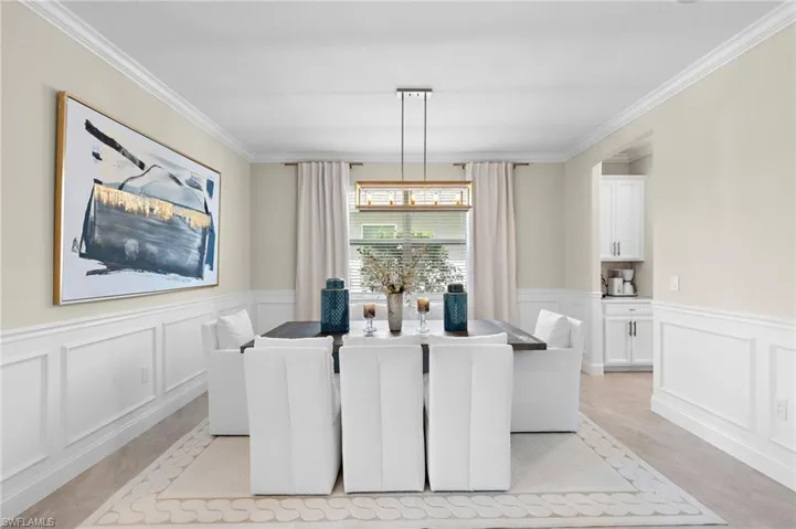 Tiled dining room with ornamental molding