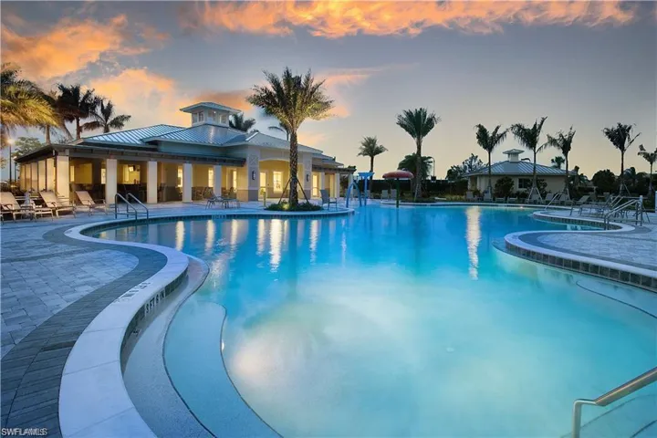 Pool at dusk with a patio