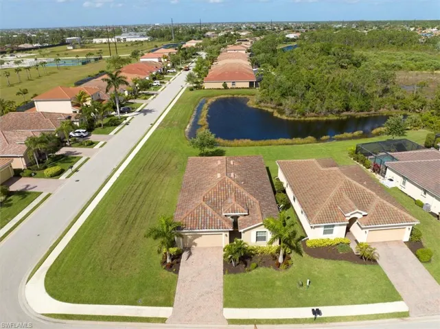 Aerial view of home shows prime corner lot and waterfront location!
