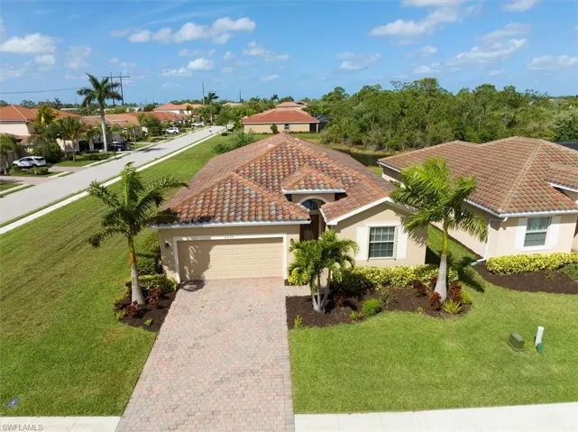 Welcome home to 2492 Sawgrass Lake Ct set on level corner lot!