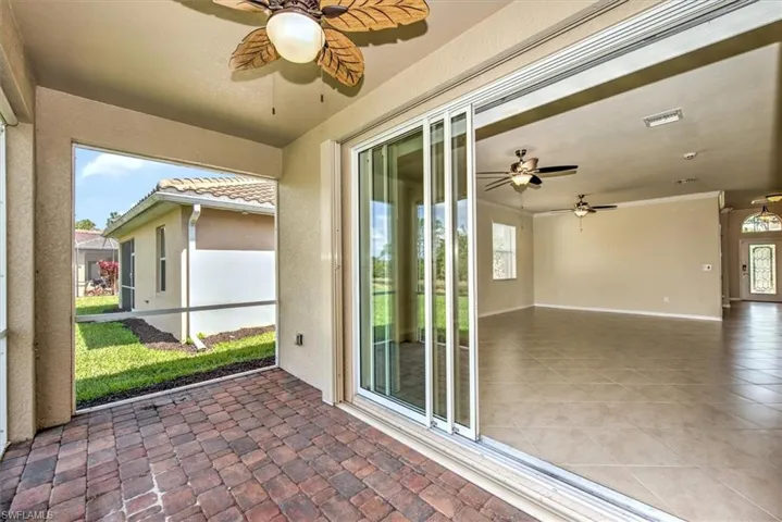Another view of screened lanai, complete with hurrican accordion shutter storm protection!