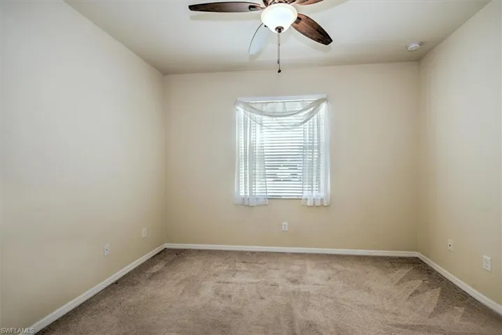 Bedroom 4 with lighted ceiling fan and as part of a mini 'suite'!
