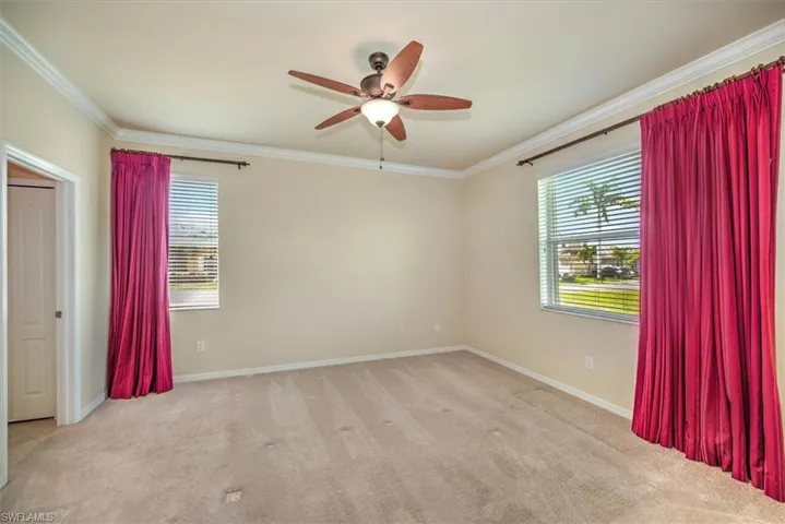Large master bedroom with lighted ceiling fan!