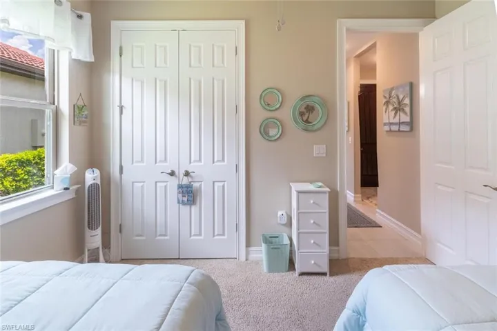 Bedroom featuring light tile floors