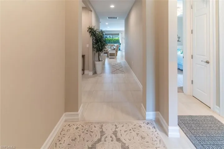 Hallway with light tile floors