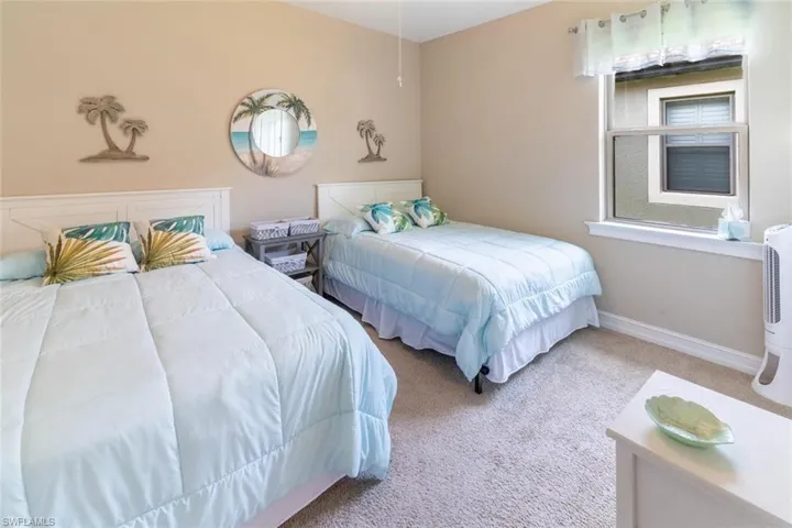 Bedroom with light carpet