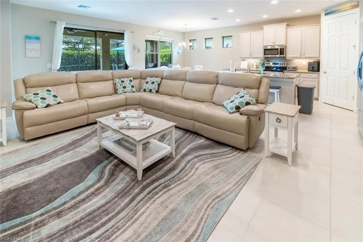 Tiled living room with an inviting chandelier