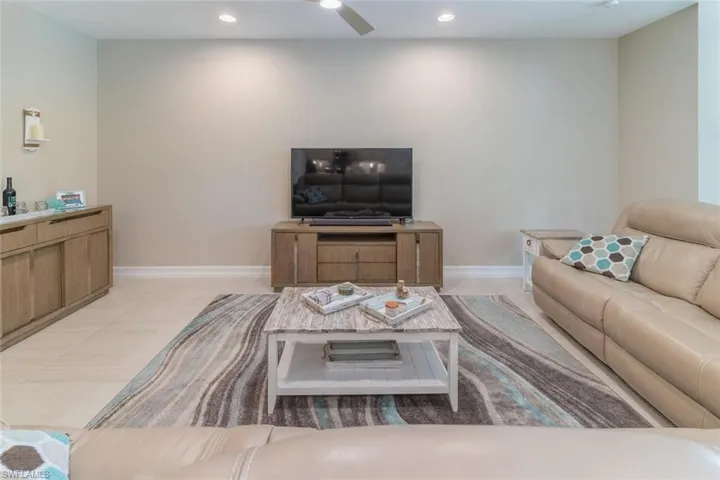 Tiled living room with ceiling fan