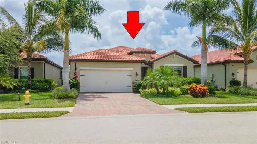 Mediterranean / spanish-style home with a garage