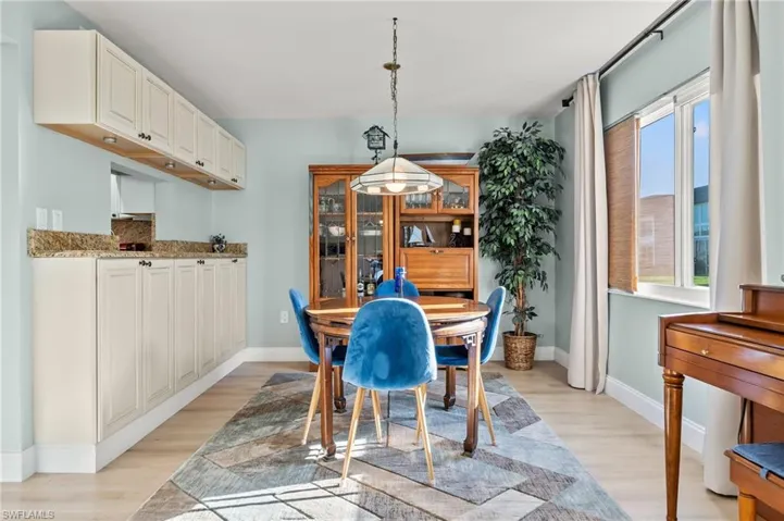 Dining area with light wood-type flooring