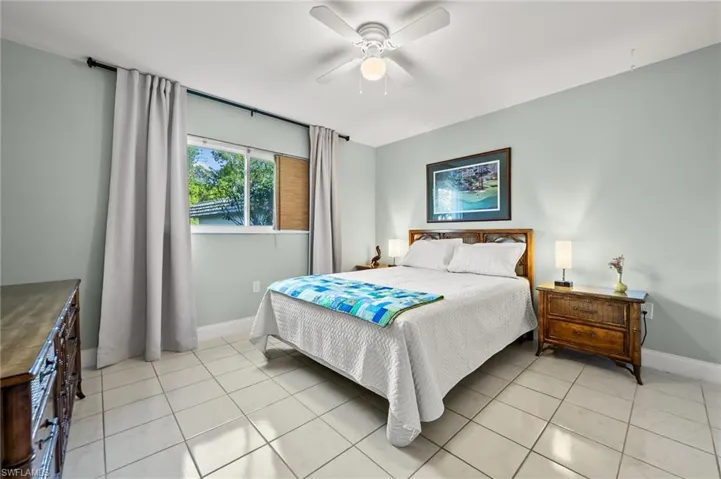 Bedroom featuring ceiling fan and light tile patterned floors