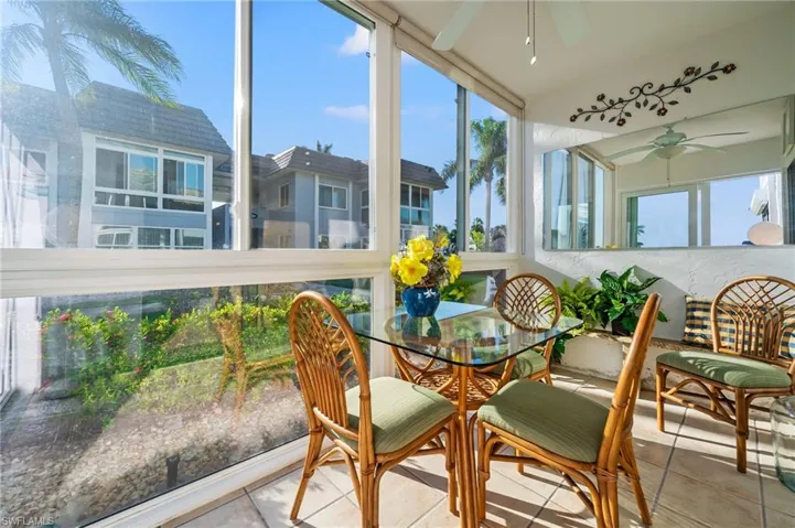 Sunroom featuring plenty of natural light and ceiling fan