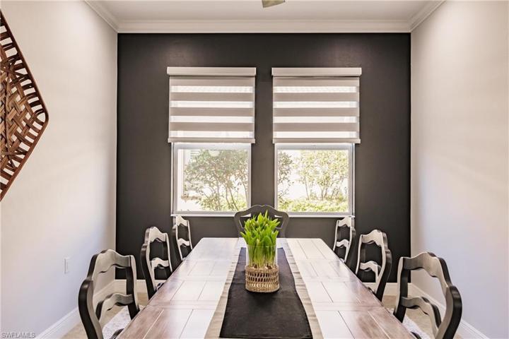 NOTE THE MATCHING ACCENT WALL, CROWN MOLDING & DUAL SHEER LOUVER SHADES!