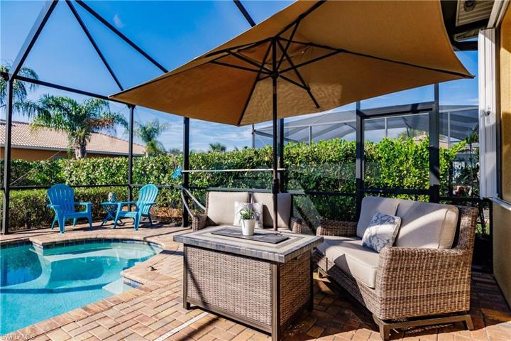 THIS POOL HOME HAS AN ENORMOUS AREA AROUND THE POOL FOR FURNITURE & TO ENTERTAIN!