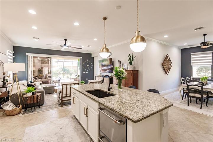 GREAT VIEW OF THE KITCHEN TO THE DINING ROOM & LIVING ROOM ALL THE WAY OUT TO YOUR FUTURE LANAI WITH A SALT WATER POOL TO ENJOY!