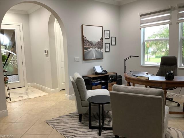 THE ENTRY ROOM TO THE HOME IS CURRENTLY BEING USED AS AN OFFICE! IT'S EXTREMELY WELL ADORNED & IS A GREAT ADDITION TO THE HOME!  NOTE THE BEAUTIFUL ARCHED ENTRYWAY