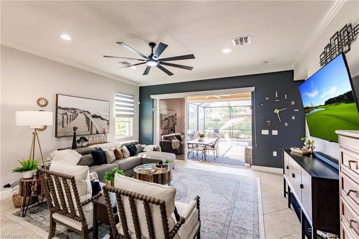 NOTE THE LARGE 3 SLIDING GLASS DOOR ENTRYWAY TO THE LANAI WITH THE ACCENT WALL & THERE IS A "HIGH END" PRIVACY BLIND THAT CAN BE PULLED ACROSS THE DOORWAY CREATING AMAZING PRIVACY!