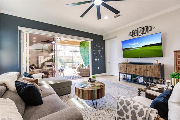 LARGE LIVING ROOM TO ENTERTAIN WITH A BEAUTIFUL ACCENT WALL, CROWN MOLDING & NEW LIGHTED FAN WITH A DC MOTOR PROVIDING AMAZING POWER & STILL UNBELIEVABLY QUIET.
