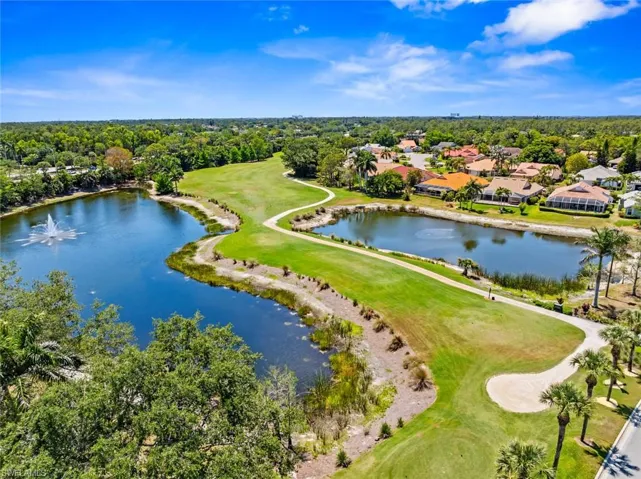 Bird's eye view featuring a residential view, golf course view, and a water view