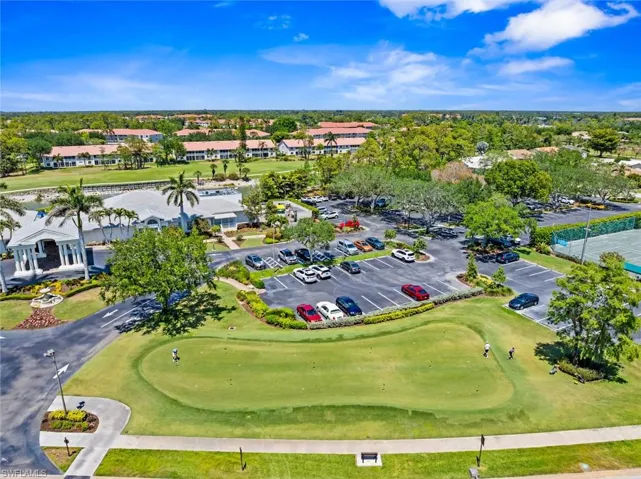 Birds eye view of property with golf course view
