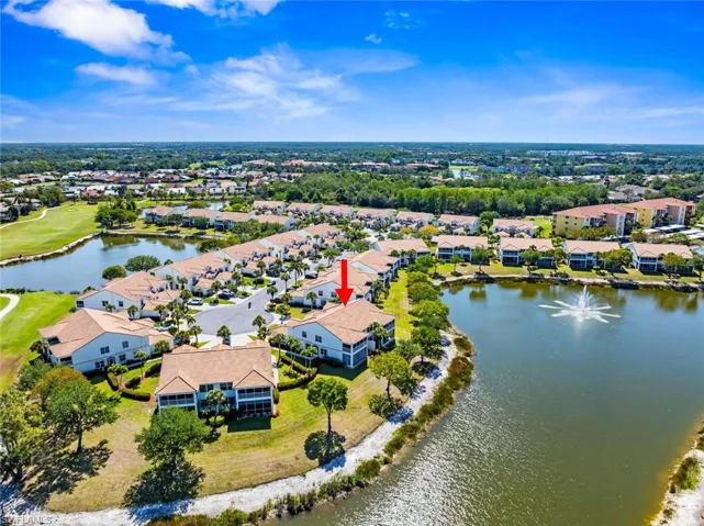 Birds eye view of property with a residential view and a water view