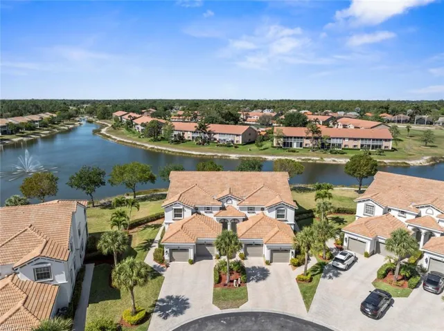 Aerial view featuring a residential view and a water view