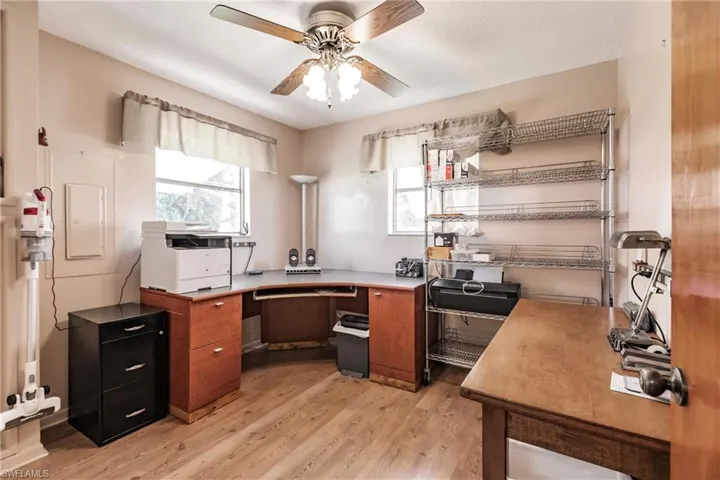 Kitchen with ceiling fan and light hardwood / wood-style floors