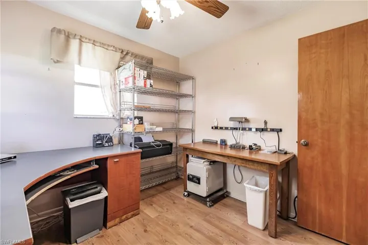 Office featuring ceiling fan and light hardwood / wood-style flooring