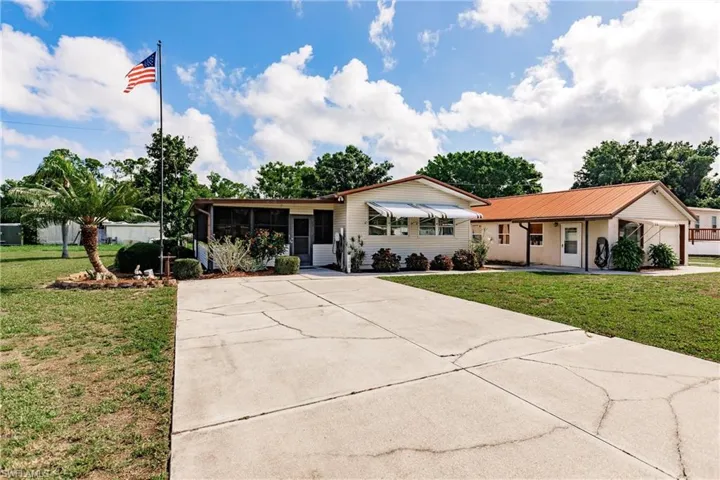 Ranch-style home with a front lawn