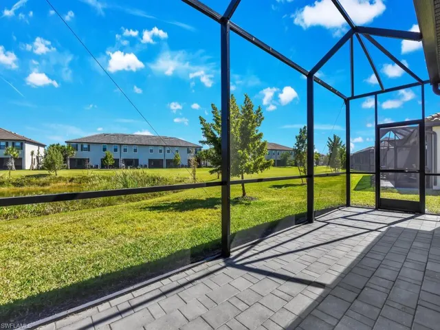 Unfurnished sunroom featuring a patio