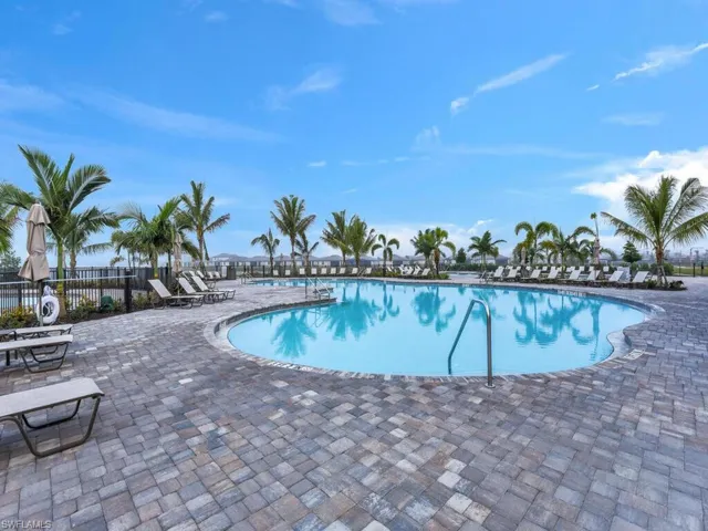 Community pool featuring a patio area