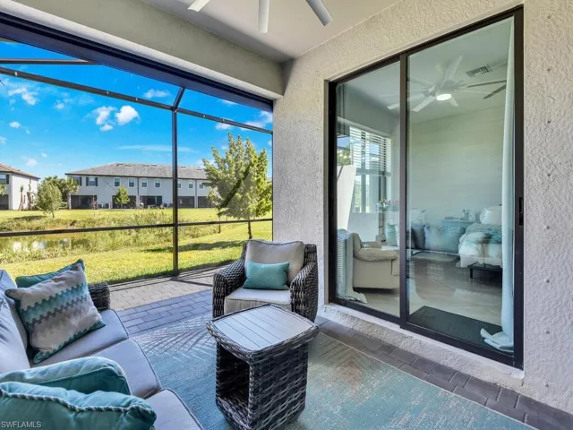 Sunroom / solarium featuring a ceiling fan, a patio area, and outdoor lounge area