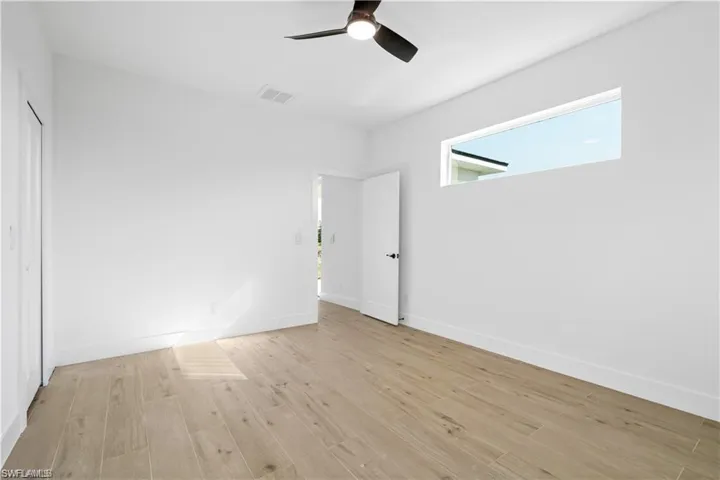 Unfurnished bedroom featuring light hardwood / wood-style flooring and ceiling fan