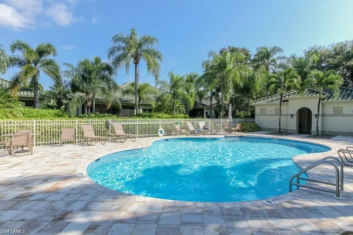 Community pool with a patio area